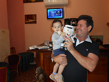 At the Taverna el Pescador, owner Eduardo took the opportunity to introduce his son to Mattie.
