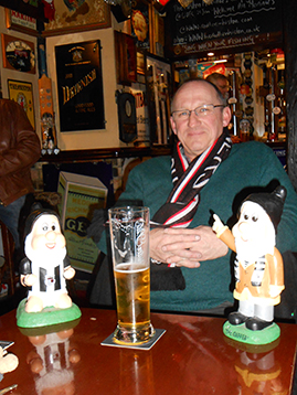 The Dean contemplates the game ahead, away from undue interference from the Battleaxe.