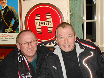 The Chairman and The Dean touch the Hewitts sign for good luck.