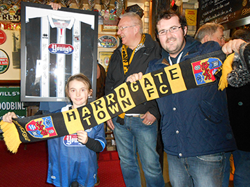 Sophie welcomes Harrogate Town representatives Andy Harrison and Mick Harland.