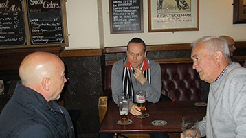 Histon Mariners, Gary the Hammer and Kevin the Web listen intently to the Presidents pre-match briefing.